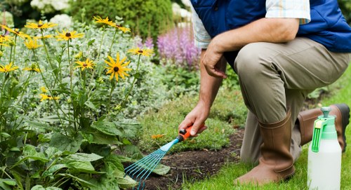 Operative performing a site risk assessment at a garden